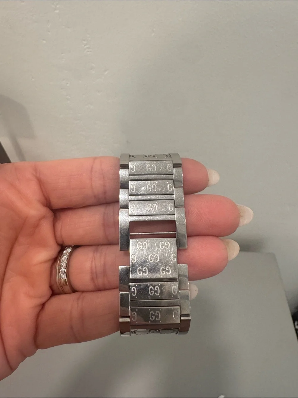 Gucci Silver-Tone GG Engraved Bangle Watch with White Dial